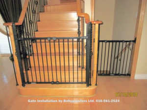 Typical black gates installed at bottom of stairs and across down stairs opening.