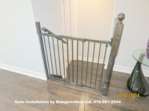 Typical baby gate installation at the top of the stairs.