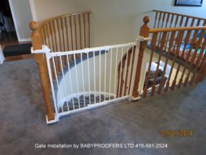 Installed baby gate between two newel posts without drilling holes.